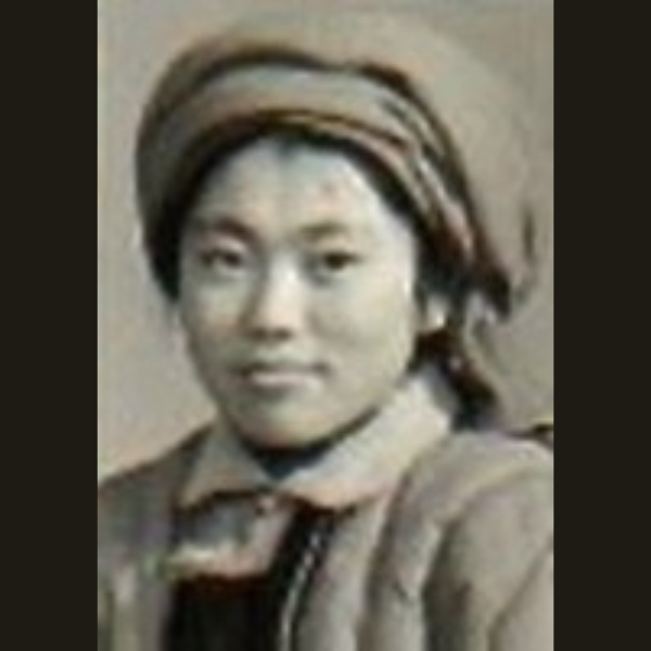 Black and white photo of a young Asian lady with a scarf wrapped around her head